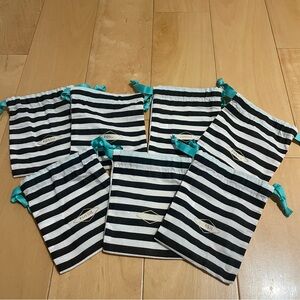 7 new Fossil black/white small pouches